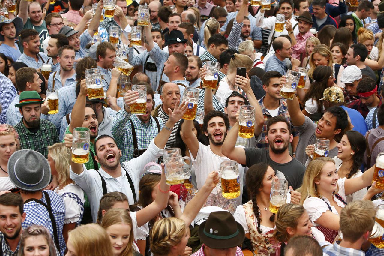 Visitors cheer with beer during the opening day of the 183rd Oktoberfest in Munich, Germany, September 17, 2016. REUTERS/Michaela Rehle
