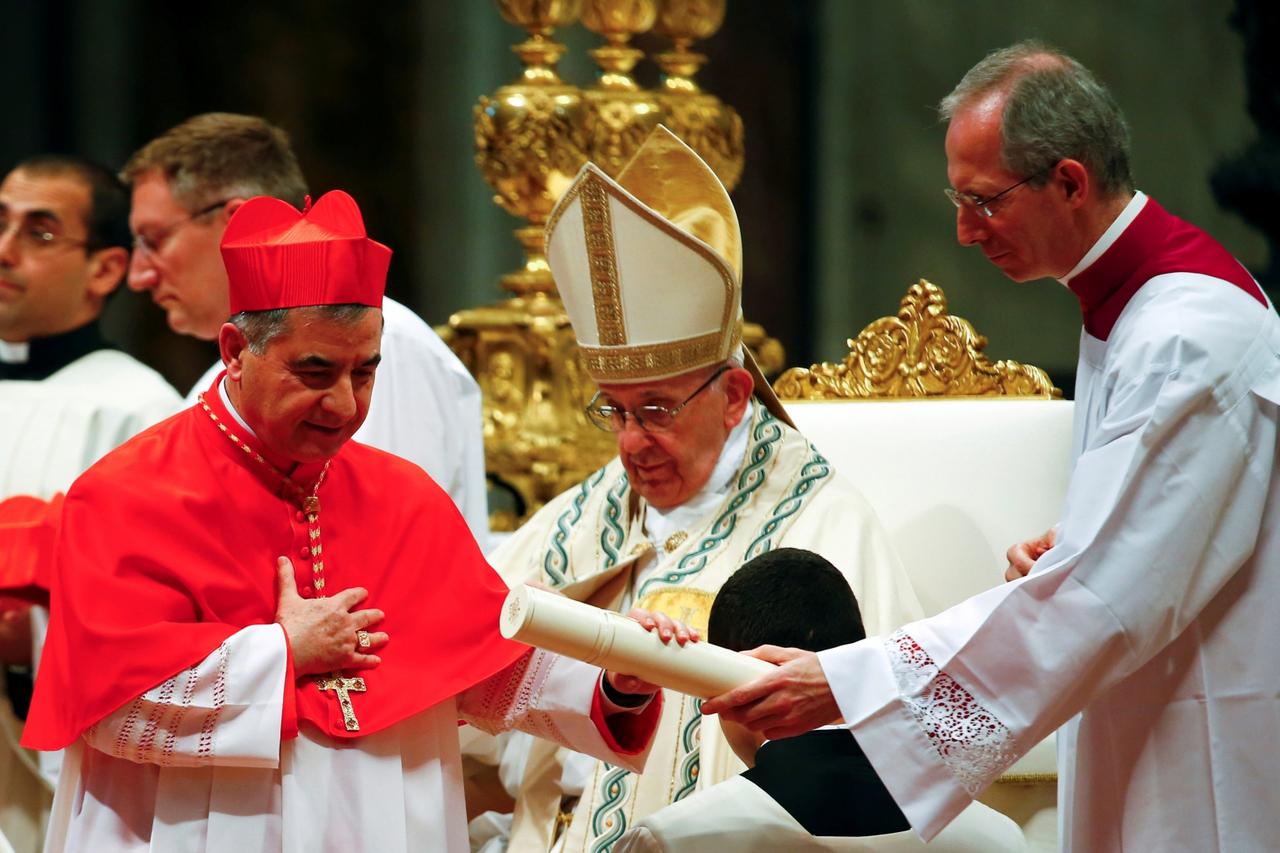 FILE PHOTO: New cardinal Giovanni Angelo Becciu of Italy is seen during a consistory ceremony to install 14 new cardinals in Saint Peter's Basilica at the Vatican