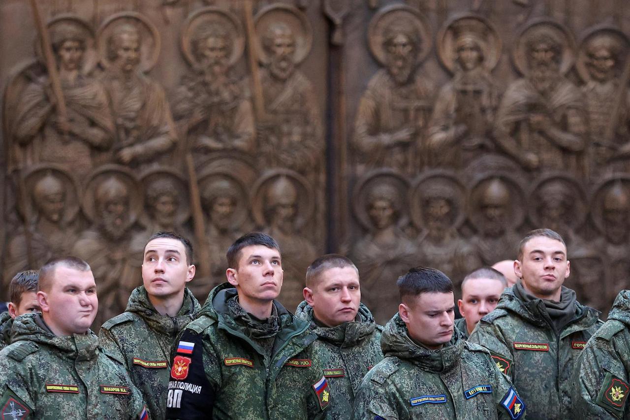 People attend a prayer at the Main Cathedral of the Russian Armed Forces near Moscow