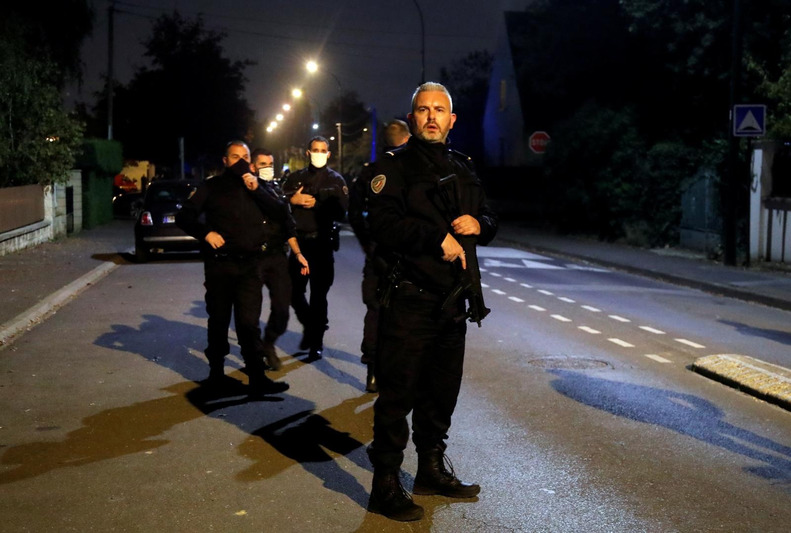 Stabbing attack in the Paris suburb of Conflans St Honorine Police officers secure the area near the scene of a stabbing attack in the Paris suburb of Conflans St Honorine, France, October 16, 2020. REUTERS/Charles Platiau CHARLES PLATIAU