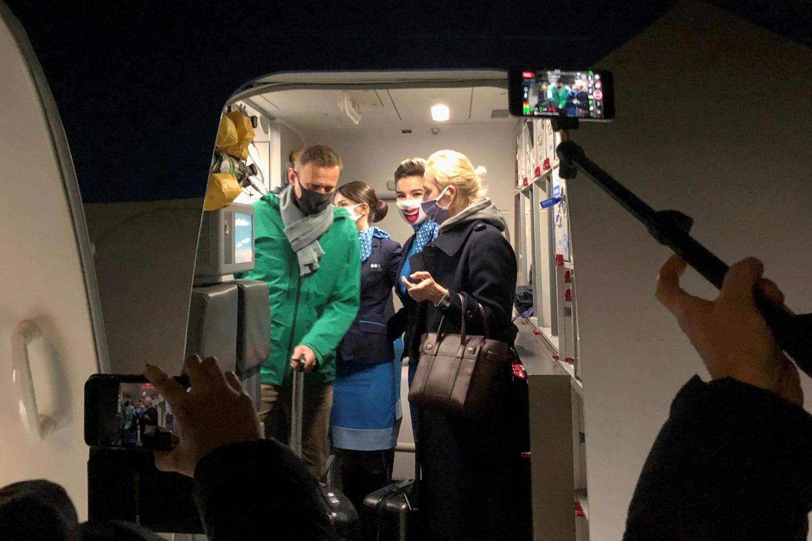 FILE PHOTO: Russian opposition leader Alexei Navalny arrives in Moscow FILE PHOTO: Russian opposition leader Alexei Navalny and his wife Yulia Navalnaya walk out of a plane after arriving at Sheremetyevo airport in Moscow, Russia January 17, 2021. REUTERS/Polina Ivanova/File Photo STAFF