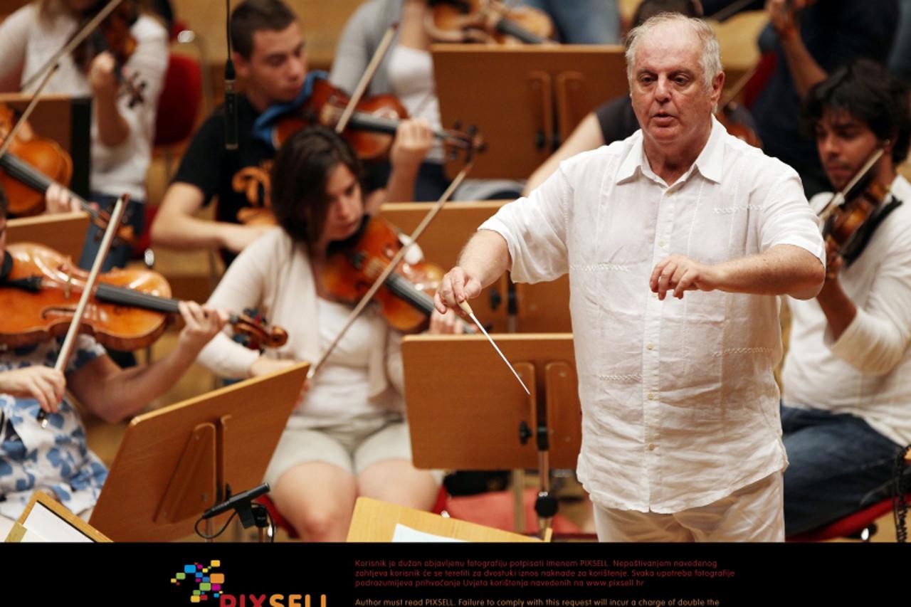 'Conductor Daniel Barenboim rehearses with the West-Eastern Divan Orchestra in Cologne, Germany, 23 August 2011. From 23 until 28 August 2011, Barenboim will lead the philharmony in playing all of the