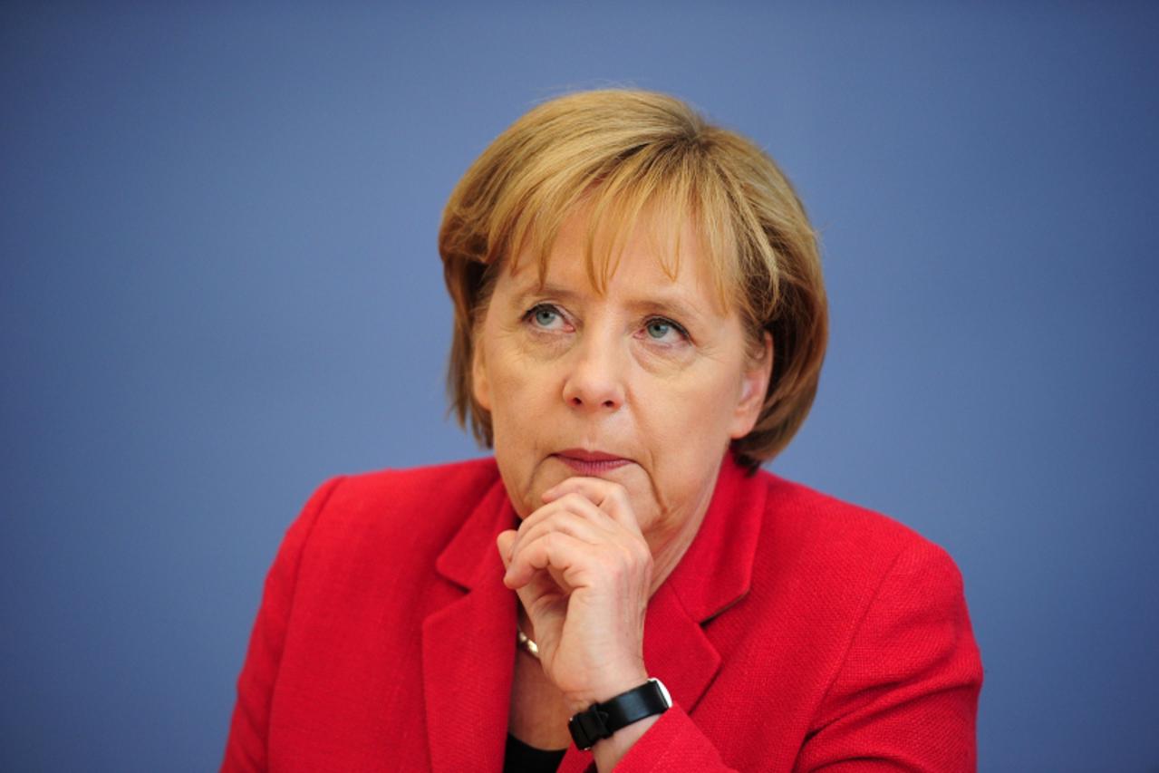 'FILES - Picture taken on June 7, 2010 shows German Chancellor Angela Merkel addressing a press conference in Berlin,  where she reported on the results of two-day talks with her ministers on the fede