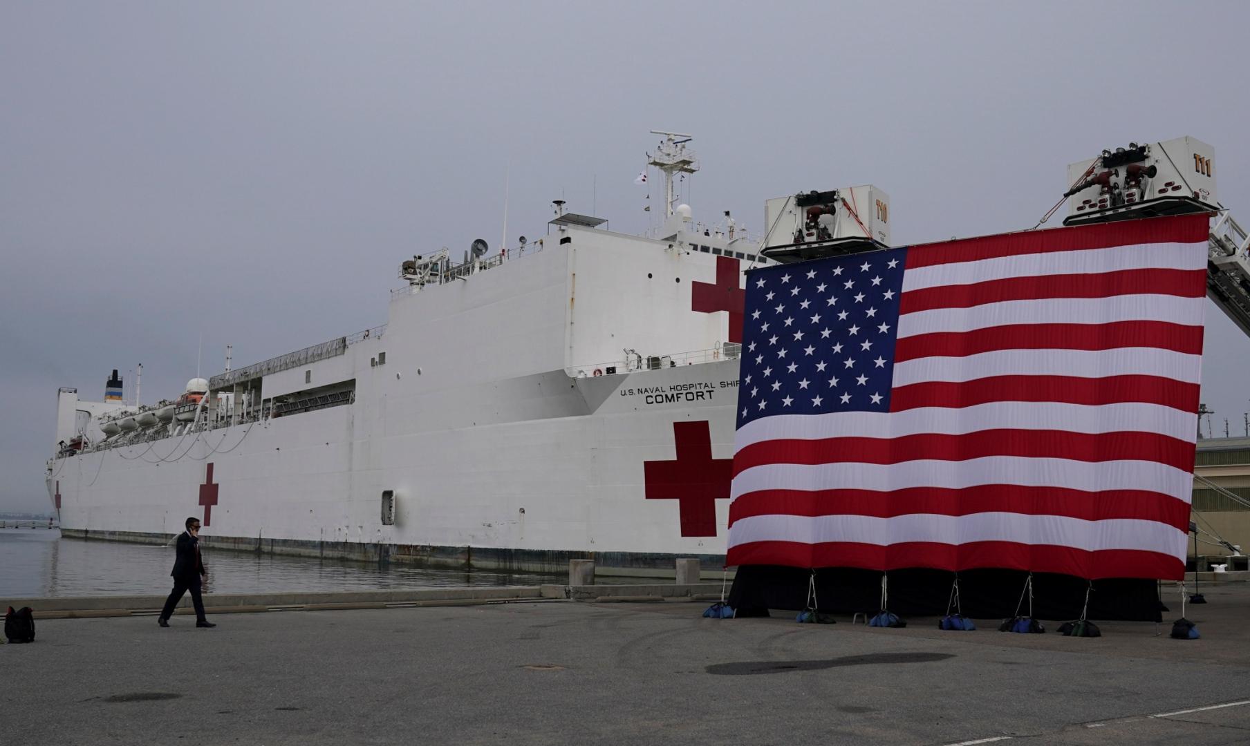 Trump visits Naval Station Norfolk, Virginia, for a send off for a hospital ship departing for New York to aid in coronavirus treatment The hospital ship USNS Comfort, which will depart for New York to help with the coronavirus disease (COVID-19) crisis, sits behind a big flag prior to the arrival of U.S. President Donald Trump to give the ship a send-off at Naval Station Norfolk, in Norfolk, Virginia, U.S., March 28, 2020. REUTERS/Kevin Lamarque KEVIN LAMARQUE