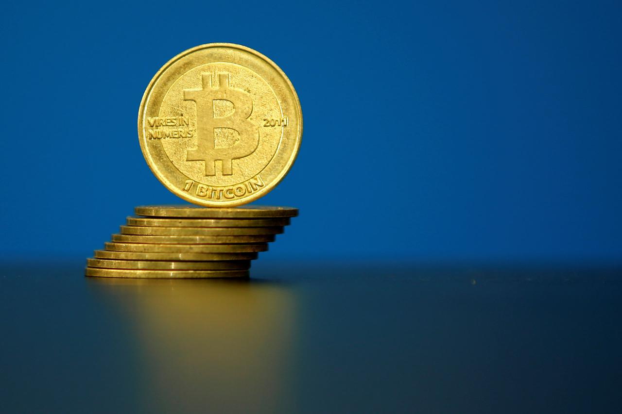 FILE PHOTO: An illustration photo of Bitcoin (virtual currency) coins are seen at La Maison du Bitcoin in Paris FILE PHOTO: Bitcoin (virtual currency) coins are seen in an illustration picture taken at La Maison du Bitcoin in Paris, France, May 27, 2015. 