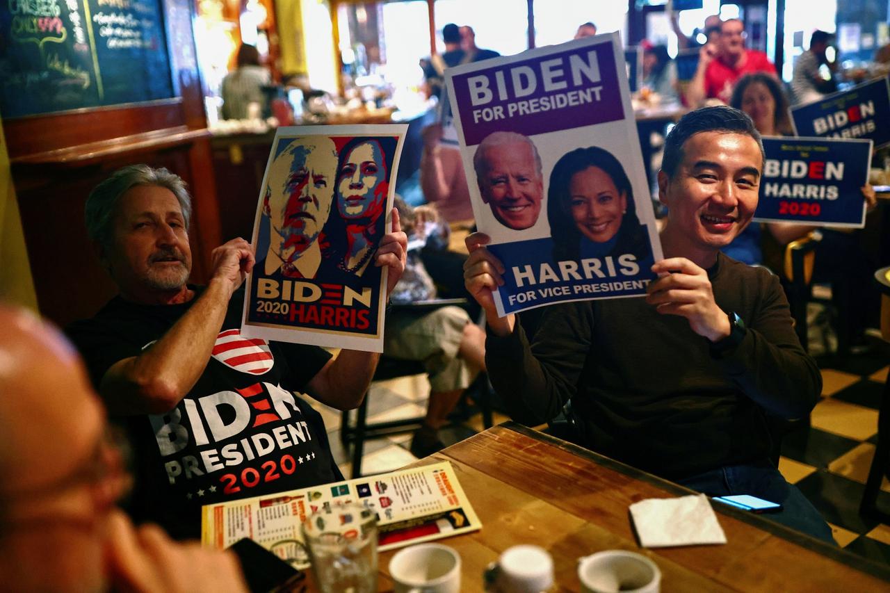 People watch live results of the U.S. election at a bar in Taipei, Taiwan
