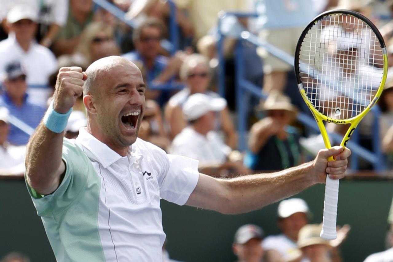 'Ivan Ljubicic of Croatia celebrates his semi-final victory over Rafael Nadal of Spain at the Indian Wells ATP tennis tournament in Indian Wells, California March 20, 2010.   REUTERS/Kevin Lamarque  (