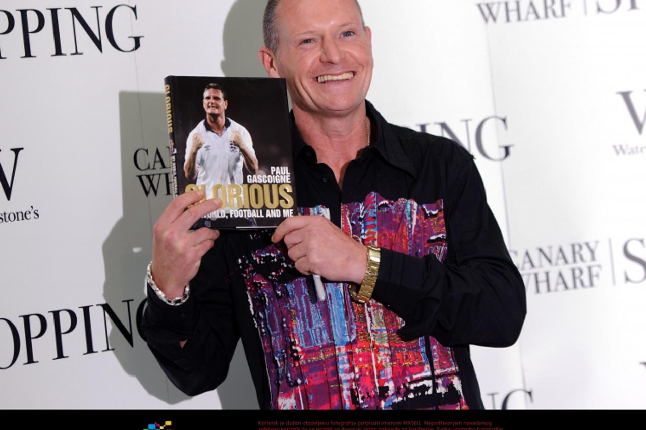'Paul Gascoigne signs copies of his new book, Glorious: My World, Football and Me, at Waterstone\'s book shop in Canary Wharf, east London. Photo: Press Association/Pixsell'
