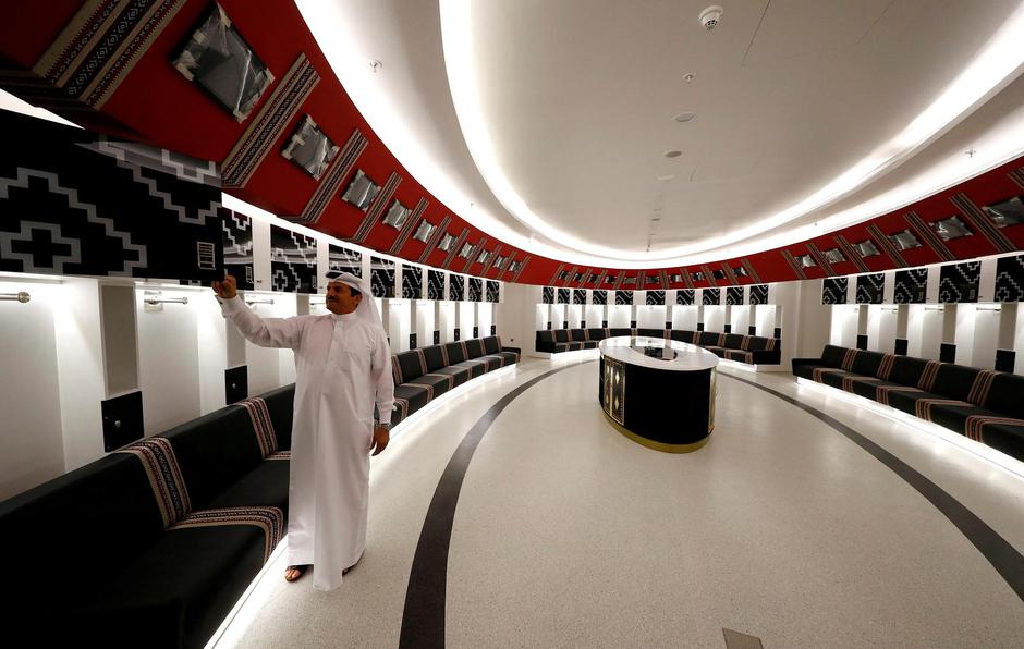 FILE PHOTO: An official stands inside one of the players' dressing rooms at the Al Bayt stadium, built for the upcoming 2022 FIFA World Cup soccer championship, during a stadium tour in Al Khor