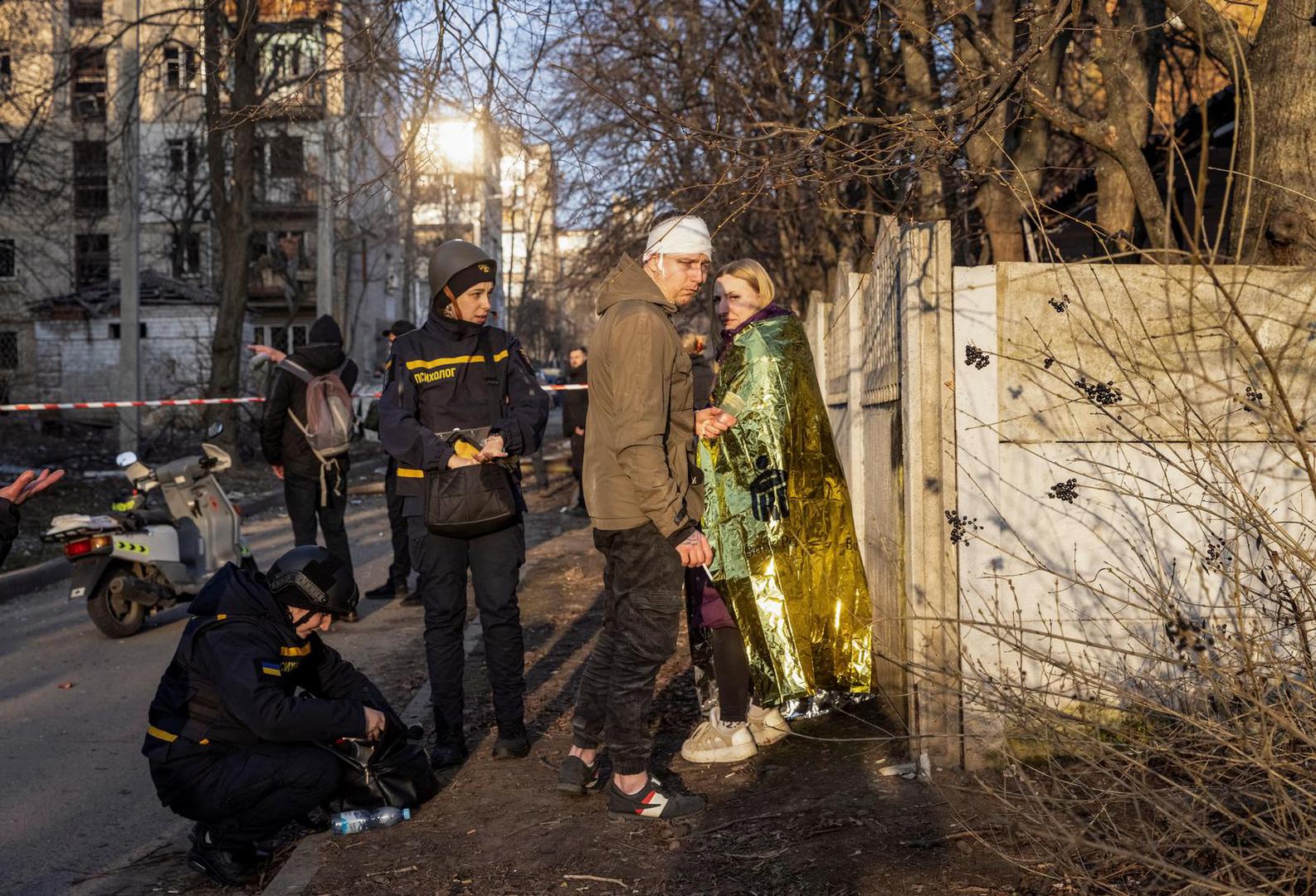 Wounded local residents stand at the site where buildings were damaged by a Russian military strike, amid Russia's attack on Ukraine, in Kharkiv, Ukraine March 27, 2024. REUTERS/Yevhen Titov Photo: Yevhen Titov/REUTERS