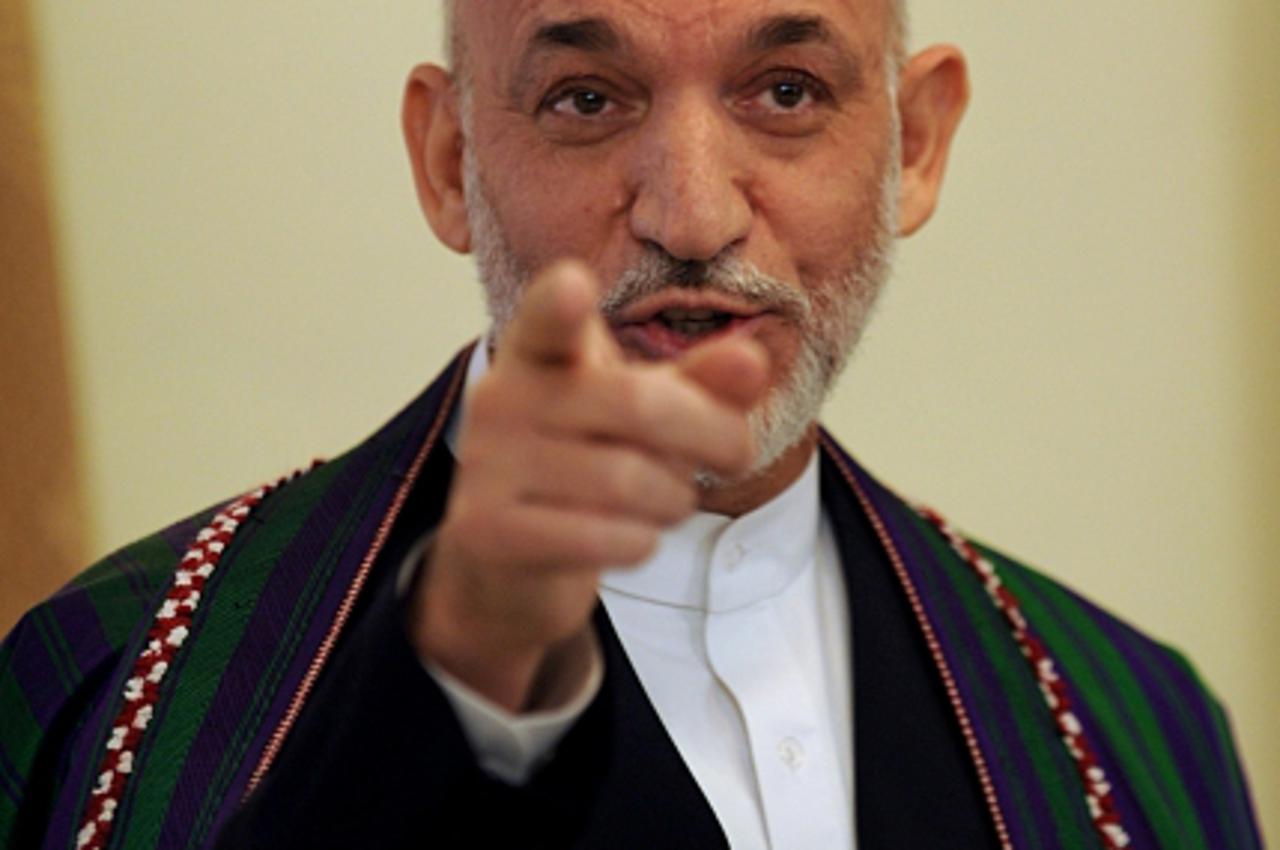 'Afghan President Hamid Karzai addresses a press conference at the Presidential Palace in Kabul on September 17, 2009. Karzai on September 17 flatly denied major fraud in Afghanistan\'s troubled elect