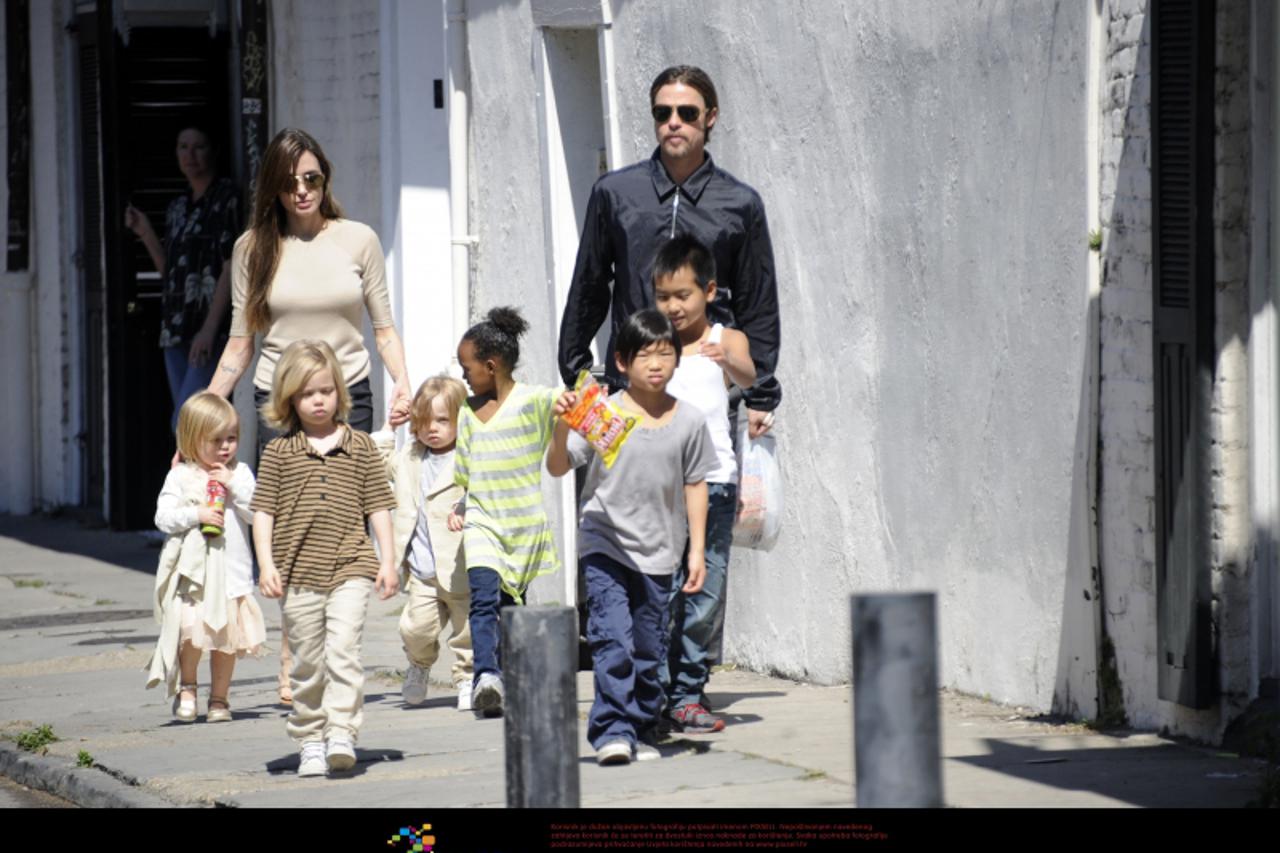 'Brad Pitt and Angelina Jolie go for a walk with their six children Maddox, Pax, Zahara, Shiloh, Knox, and Vivienne in their neighborhood in New Orleans, LA, USA on March 20, 2011. Photo: Press Associ