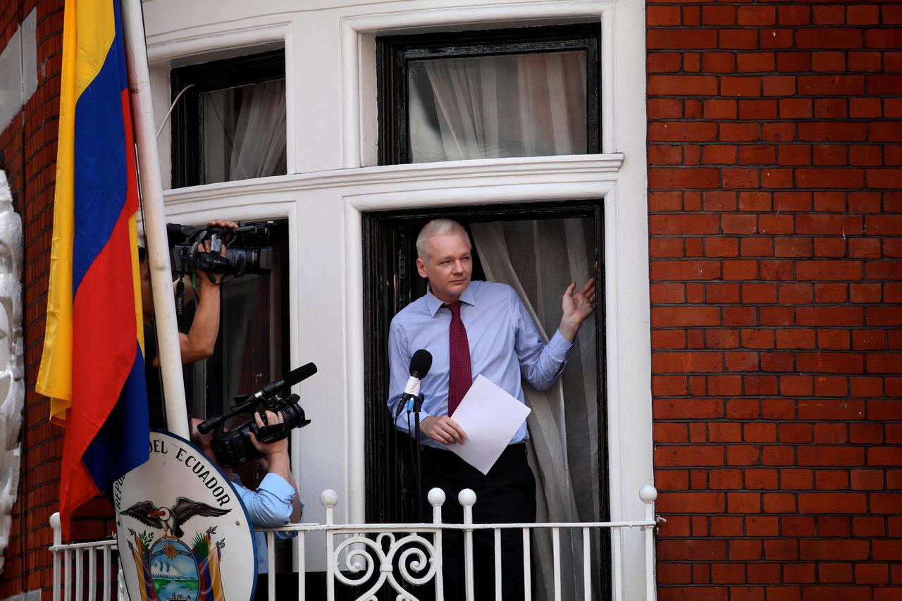 Julian Assange addresses a crowd of hundreds from the balcony of the Embassy of Ecuador in Knightsbridge, today. The Wikileaks founder, who has been granted asylum by Ecuador, called for the freedom of Bradley Manning and condemned the British government.