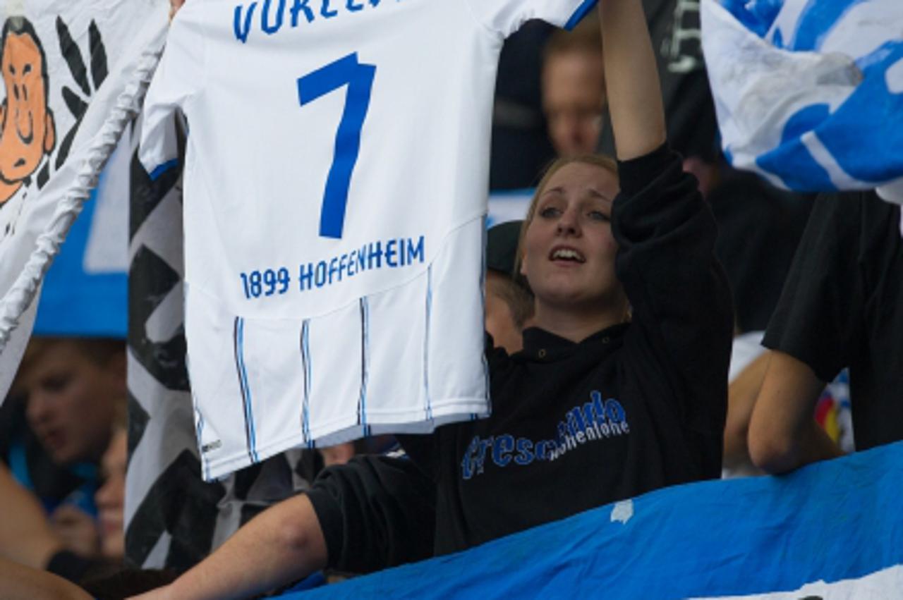 'Supporters of Hoffenheim hold up a jersey to wish all the best to their Croatian-born midfielder Boris Vukcevic, who suffered from severe injuries as he had a car accident the day before, prior to th
