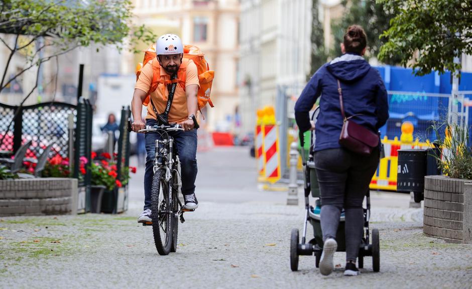Former Afghan Communication Minister Sadaat works as a bicycle rider for the food delivery service Lieferando in Leipzig