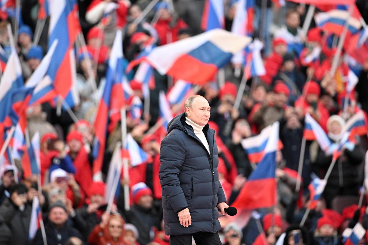 FILE PHOTO: Russian President Vladimir Putin attends a concert marking the eighth anniversary of Russia's annexation of Crimea in Moscow