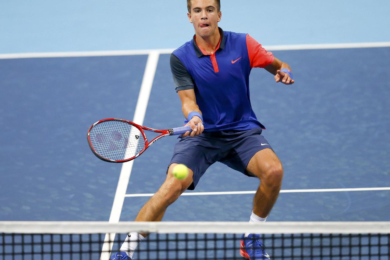 Croatia's Borna Coric returns the ball during his match against Ernests Gulbis of Latvia at the Swiss Indoors ATP tennis tournament in Basel October 22, 2014.    REUTERS/Arnd Wiegmann (SWITZERLAND  - Tags: SPORT TENNIS)