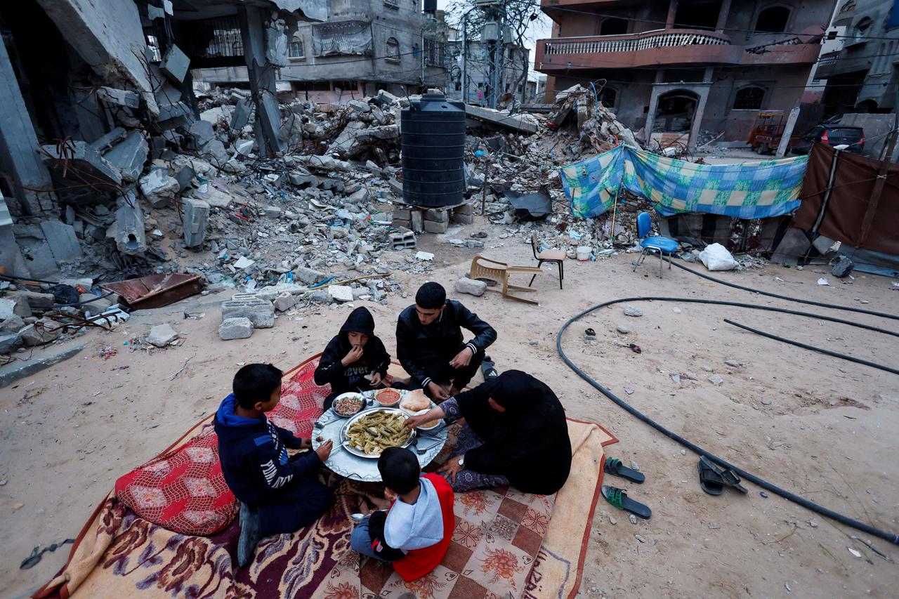 Palestinians eat iftar food during the holy month of Ramadan