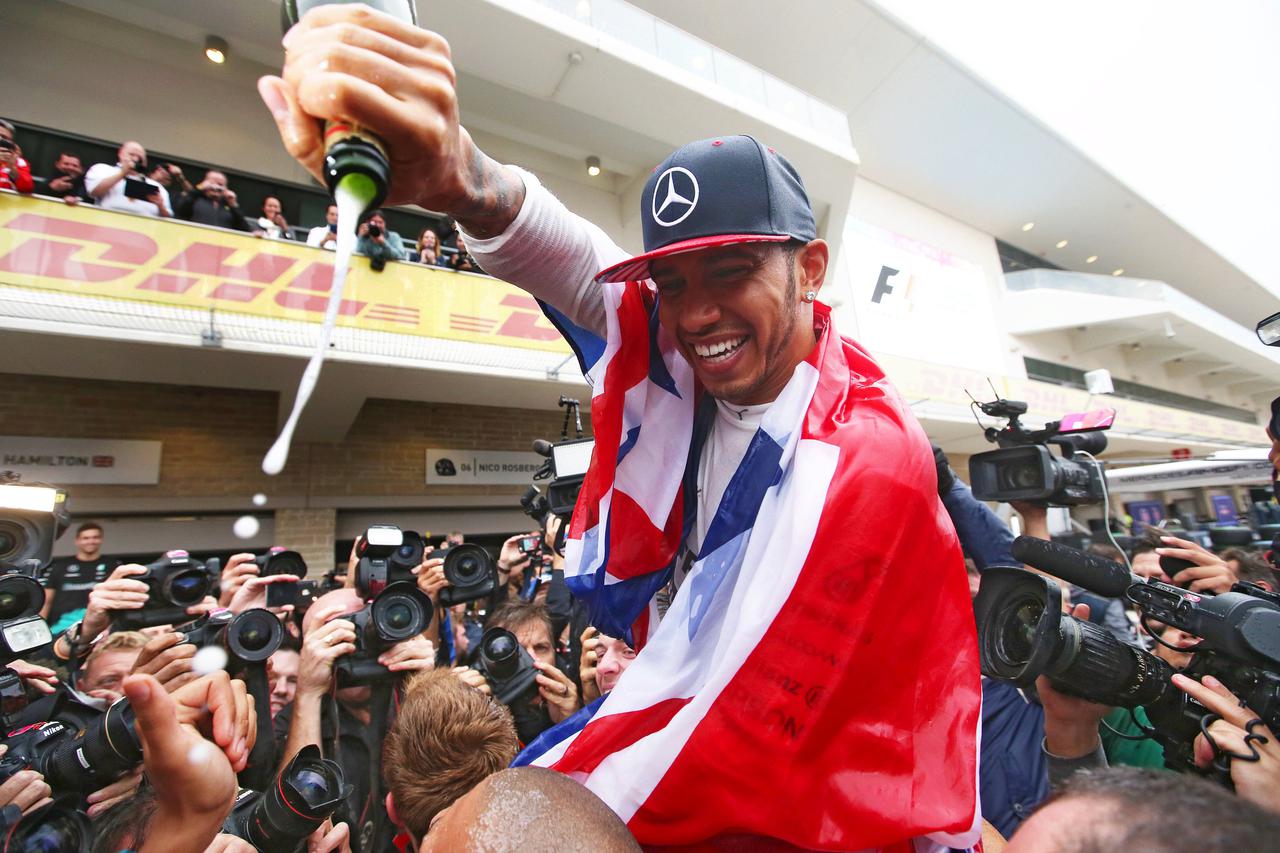 Formula One - F1 - United States Grand Prix 2015 - Circuit of the Americas, Austin, Texas, United States of America - 25/10/15Mercedes' Lewis Hamilton celebrates winning the race and the world championshipMandatory Credit: Action Images / Hoch ZweiLivepic