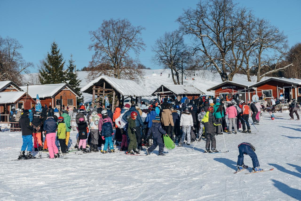 FILE PHOTO: People queue at a ski lift after the loosening of coronavirus disease (COVID-19) restrictions in the reopened resort of Zakopane