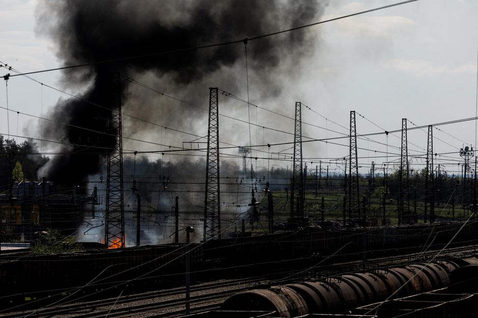 Smoke rises following a military strike on a facility near the railway station in the frontline city of Lyman
