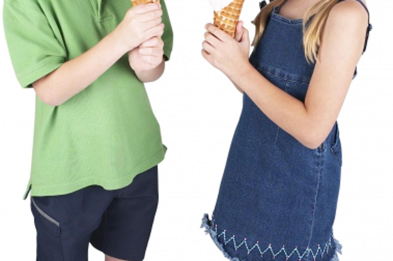 'Smiling Little Boy And Girl Eating Ice Cream Cones'