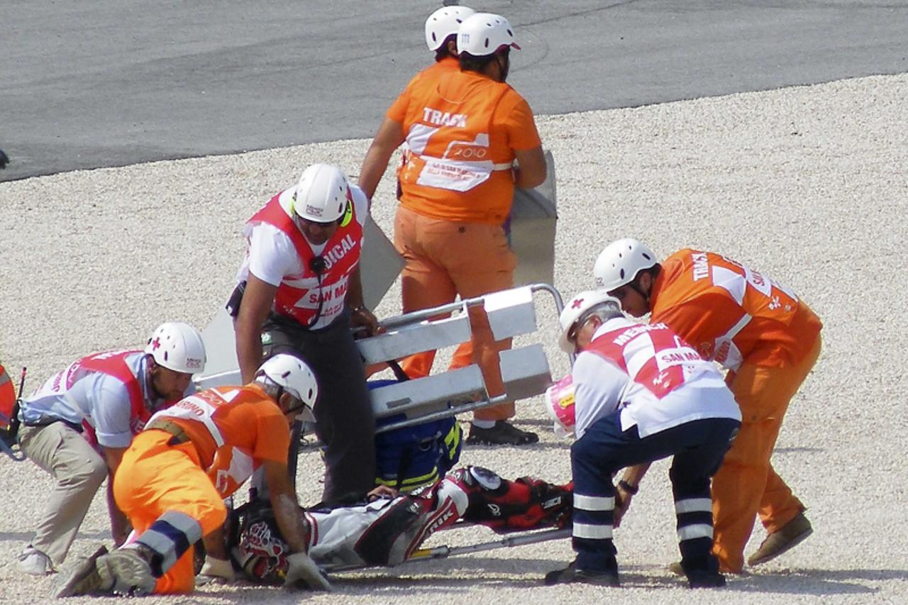 'Suter Moto2 rider Shoya Tomizawa of Japan is carried on a stretcher following a crash during the San Marino motorcycling Grand Prix at the Misano circuit September 5, 2010. Tomizawa died after suffer