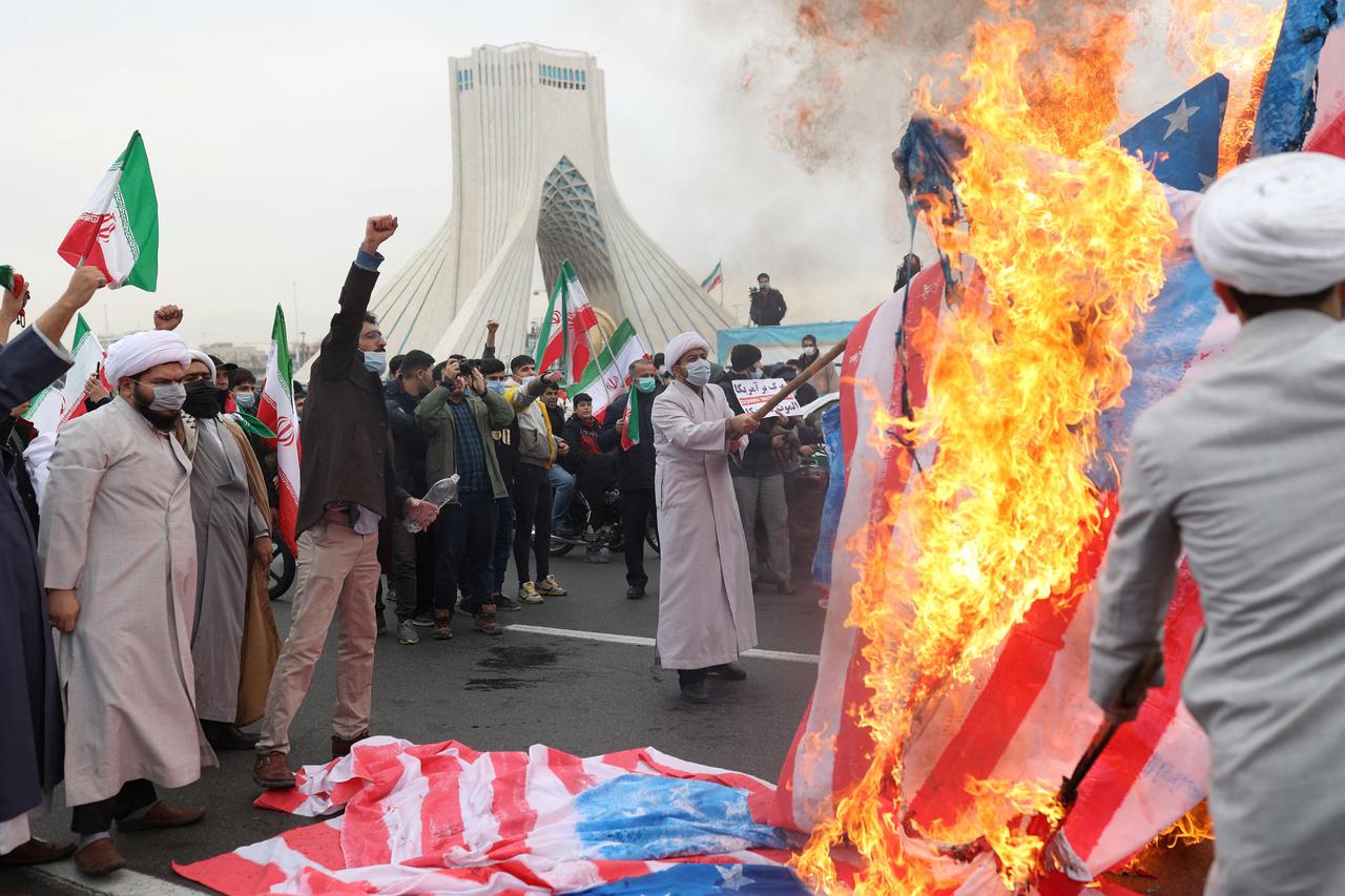 Iranians set fire to American flag during the 43rd anniversary of the Islamic Revolution in Tehran