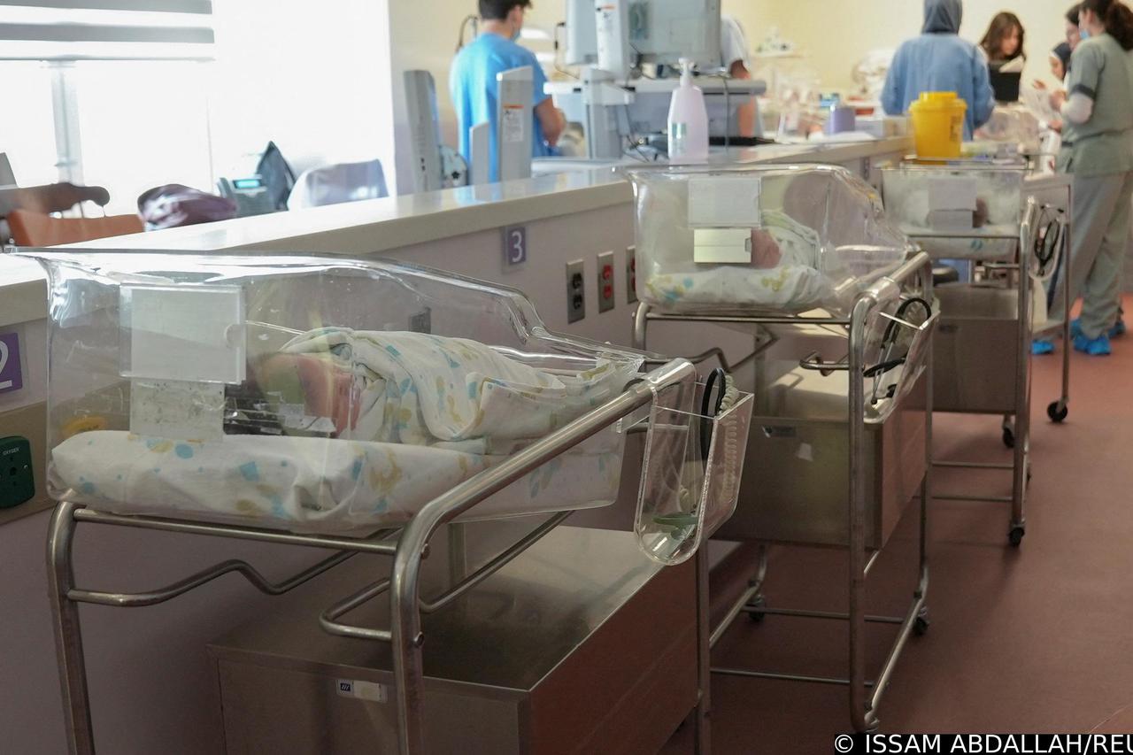 Newborn babies are seen inside cribs at a maternity ward in American University of Beirut Medical Center (AUBMC) as world's population surged past 8 billion