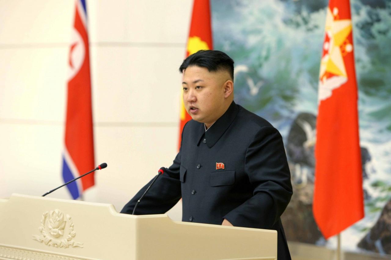 'North Korean leader Kim Jong-un speaks during a banquet held for scientists, engineers, workers and officers who took part in the launch of the Unha-3 (Milky Way 3) rocket, which carried the second v