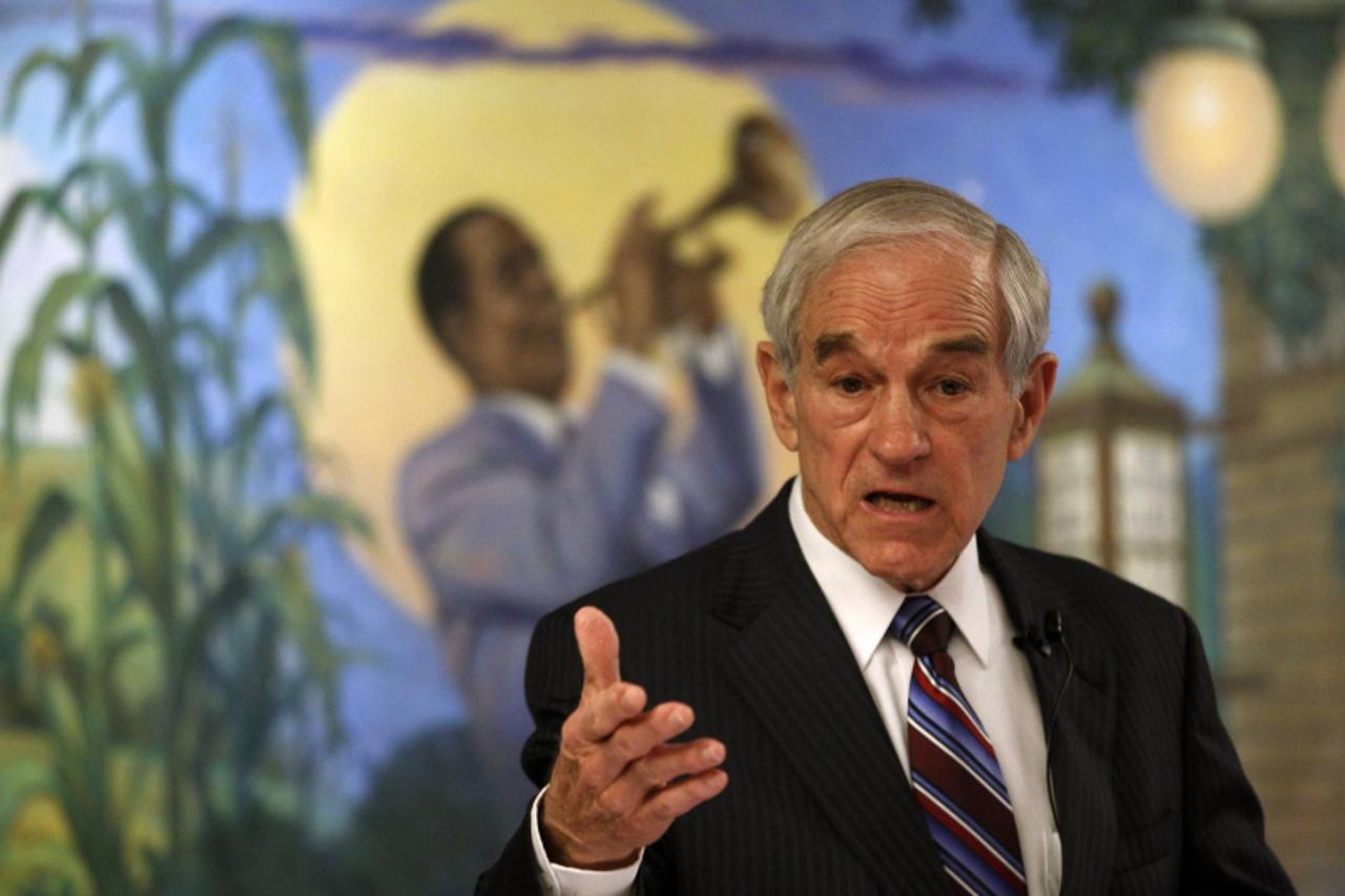 'U.S. Republican presidential candidate and Representative Ron Paul (R-TX) speaks during a Town Hall Meeting at the Hotel Pattee in Perry, Iowa, December 29, 2011.    REUTERS/Jeff Haynes (UNITED STATE