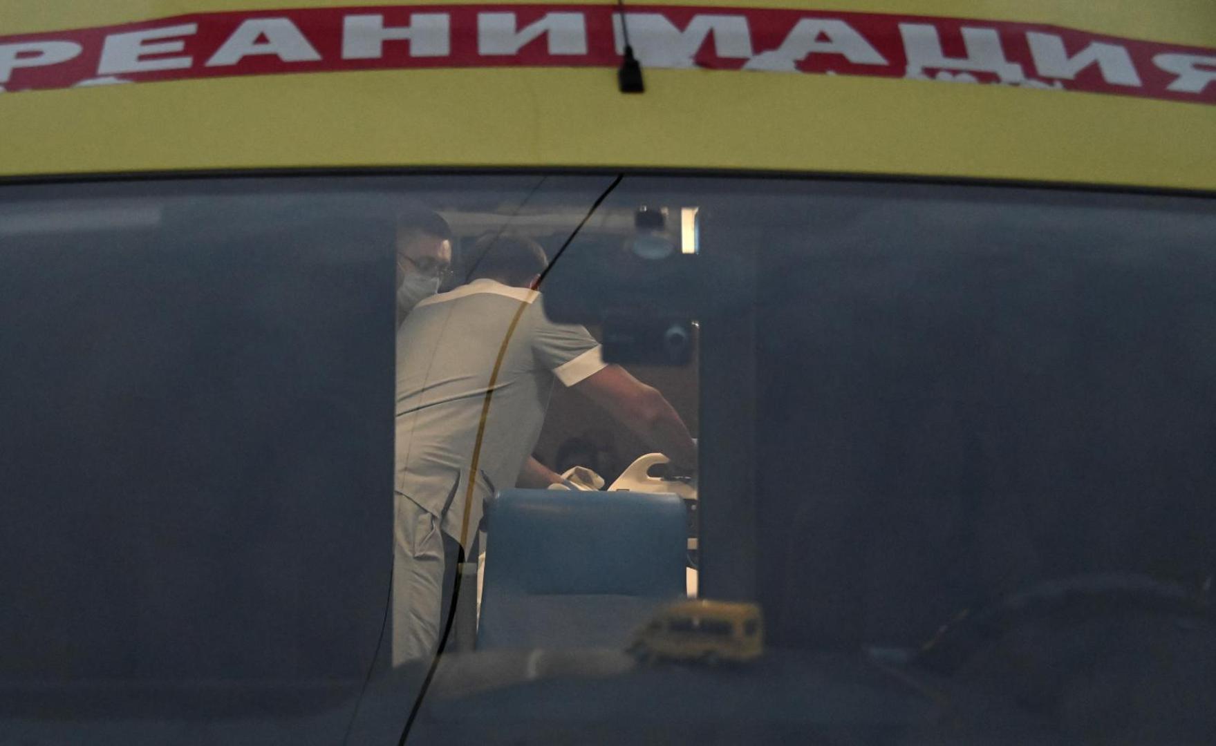 An ambulance transporting Russian opposition leader Alexei Navalny drives out of a hospital in Omsk Medical specialists surround Russian opposition leader Alexei Navalny inside an ambulance near a hospital before driving to an airport in Omsk, Russia August 22, 2020. Alexei Navalny was taken ill with suspected poisoning en route from Tomsk to Moscow on a plane, which made an emergency landing in Omsk. The local hospital delivering medical support to Navalny later allowed German doctors to fly him to Germany for treatment. REUTERS/Alexey Malgavko ALEXEY MALGAVKO