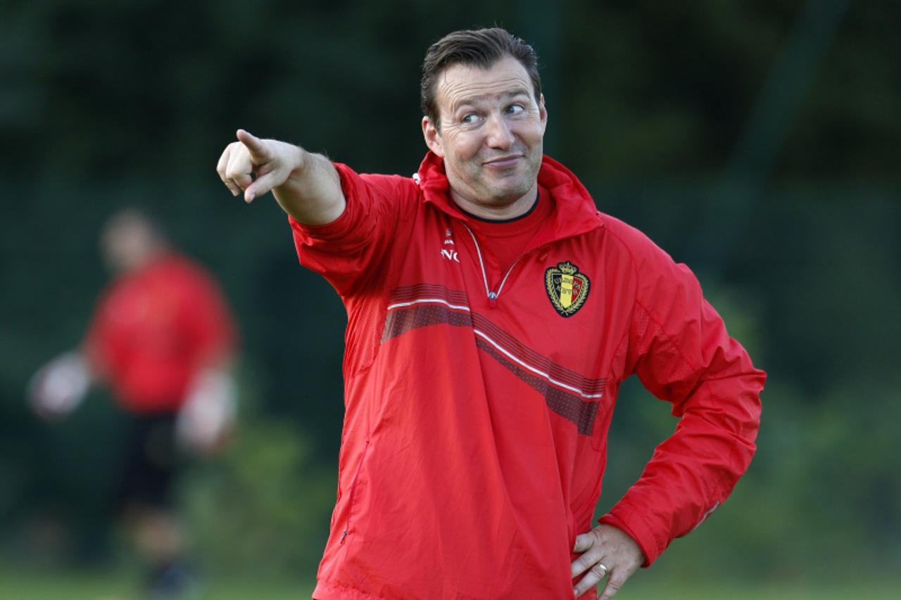 'Belgium\'s national soccer team coach Marc Wilmots gives instructions to his players during a training session in Brussels October 7, 2013. Belgium will play against Croatia in a World Cup qualifying