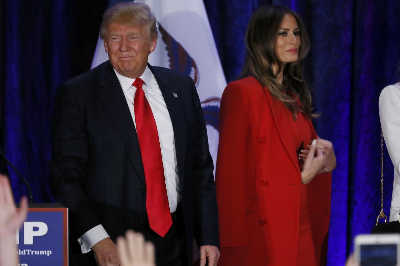 Republican U.S. presidential candidate Donald Trump and his wife Melania leave the stage at his caucus night rally in Des Moines, Iowa February 1, 2016.     REUTERS/Jim Bourg