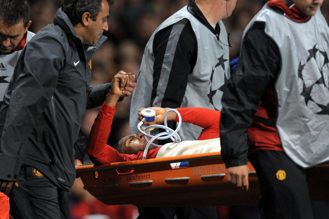 \'Manchester United\'s Ecuador midfielder Antonio Valencia receives treatment for an injury to his leg caused by a tackle from Rangers\' Scottish defender Kirk Broadfoot  (not pictured) during their U