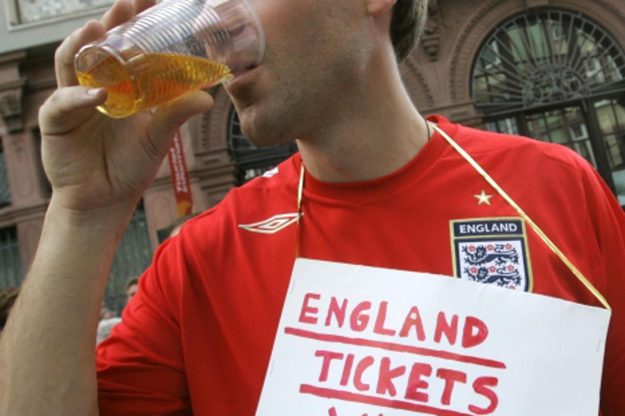 'A British soccer fan drinks beer at Roemerberg main square in downtown Frankfurt June 8, 2006. England will face Paraguay in their first group match in Frankfurt on Saturday, 10 June.  WORLD CUP 2006