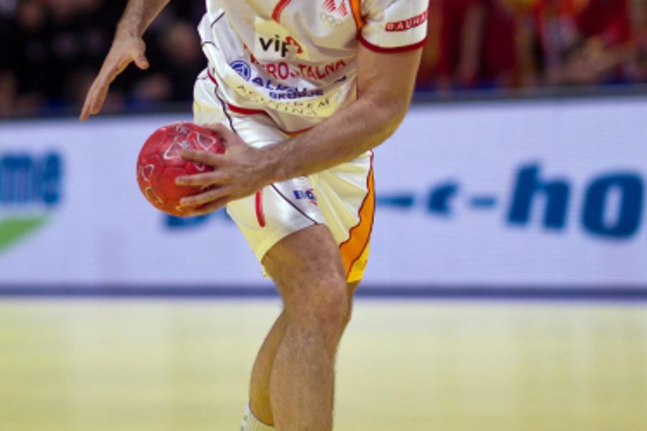 'Macedonia's Kiril Lazarov throws during the Handball European Championship group 1 match between Poland and Macedonia in Belgrad, Serbia, 23 January 2012. Photo: Jens Wolf/DPA/PIXSELL'