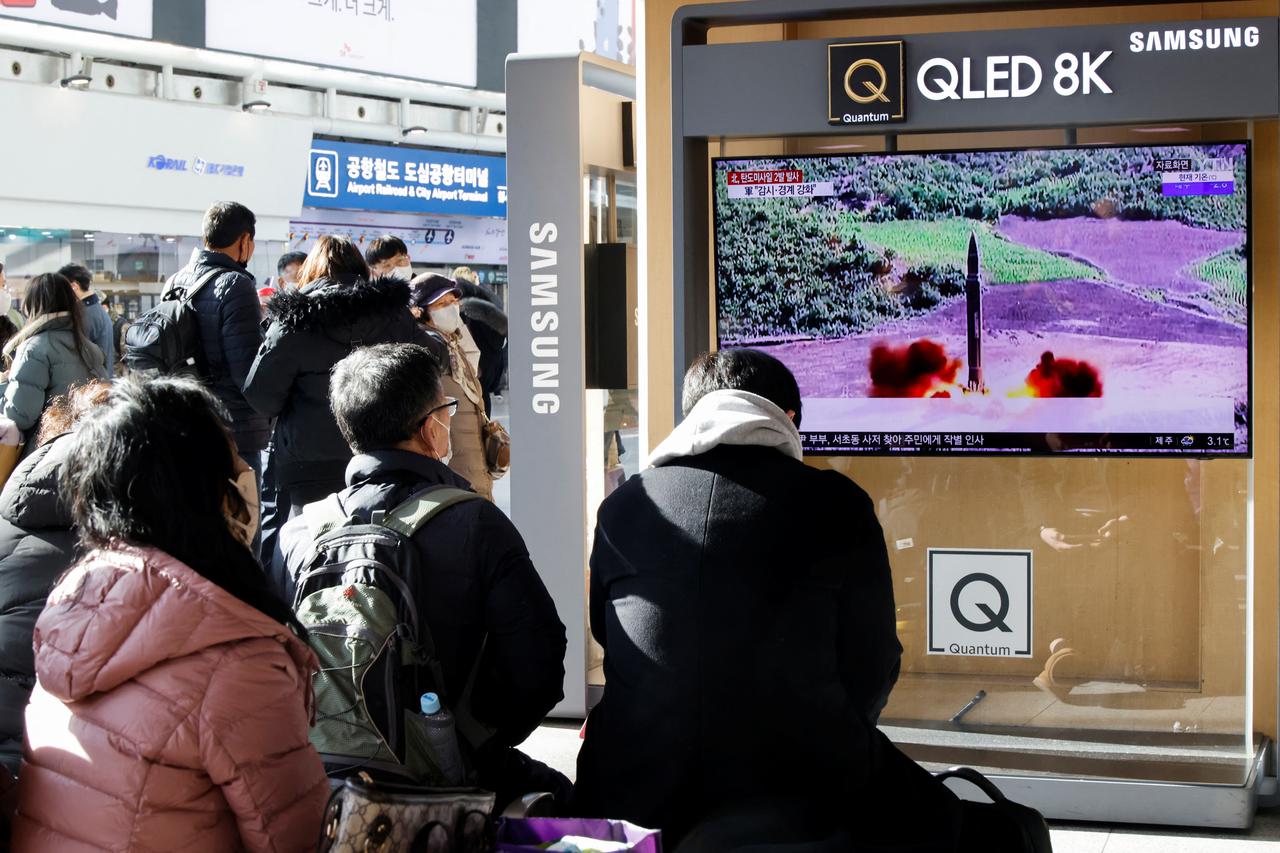 People watch a TV broadcasting a news report on North Korea firing a ballistic missile off its east coast, in Seoul