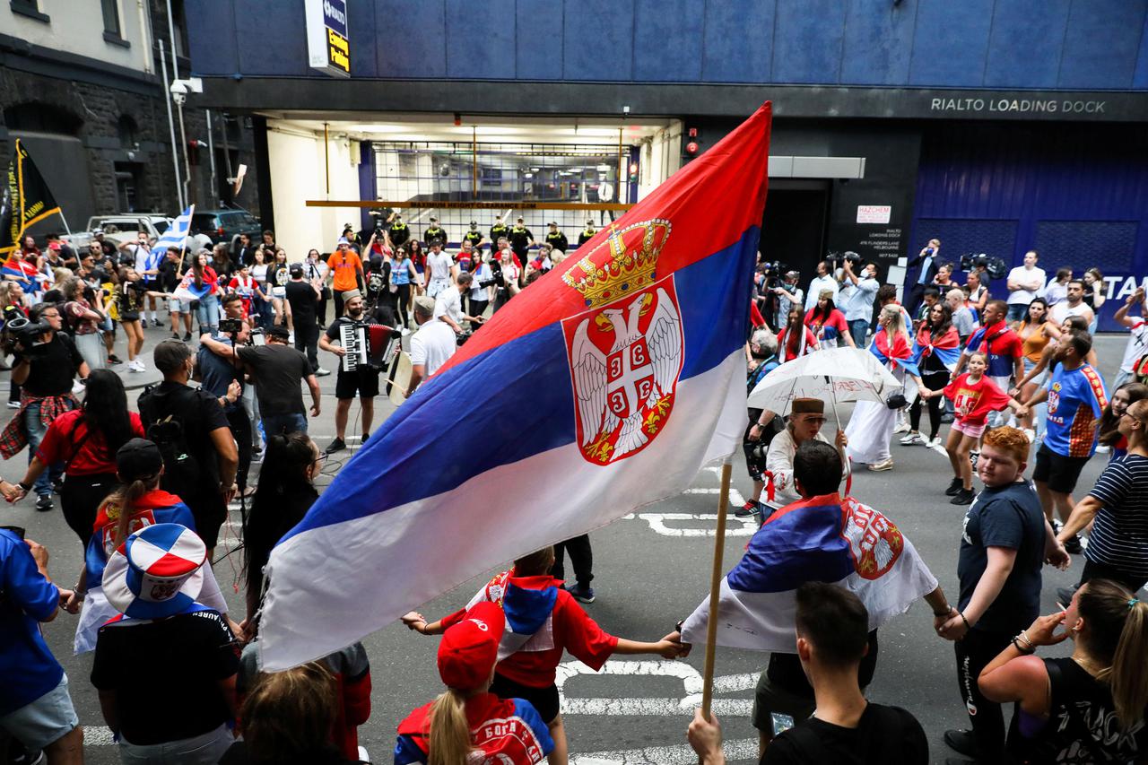 Supporters of Novak Djokovic rally on street in Melbourne