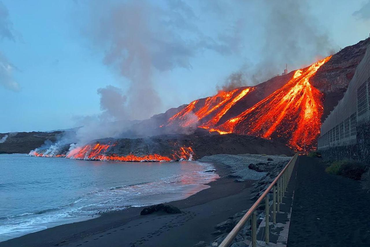 Lava spewed by volcano reaches the Atlantic Ocean at Los Guirres beach