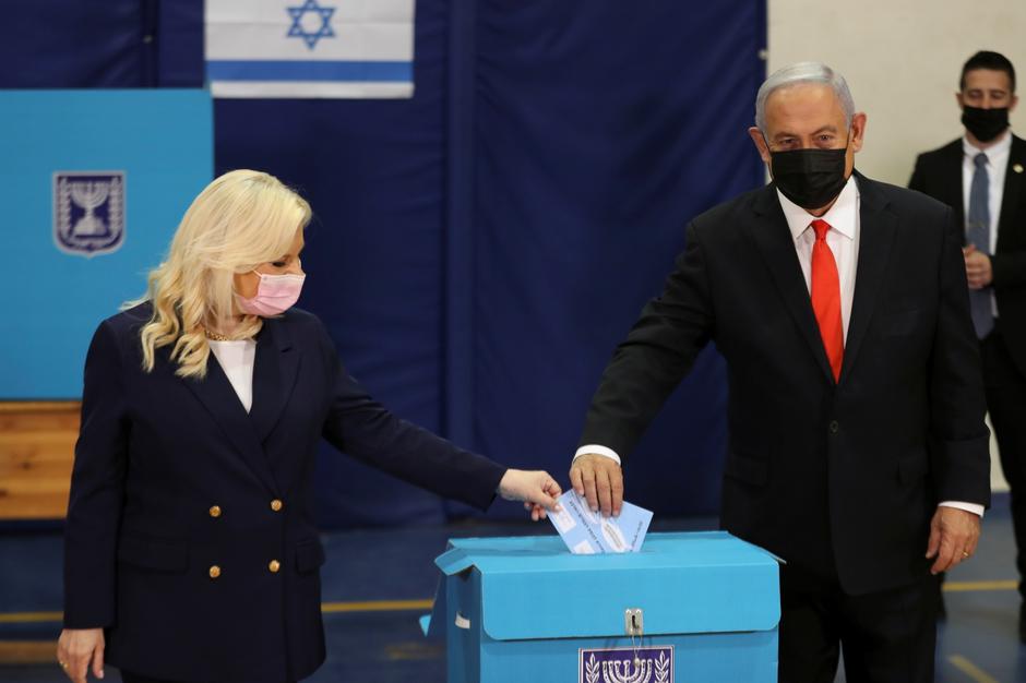 Israeli Prime Minister Benjamin Netanyahu and his wife Sara cast their ballots in Israel's general election, at a polling station in Jerusalem