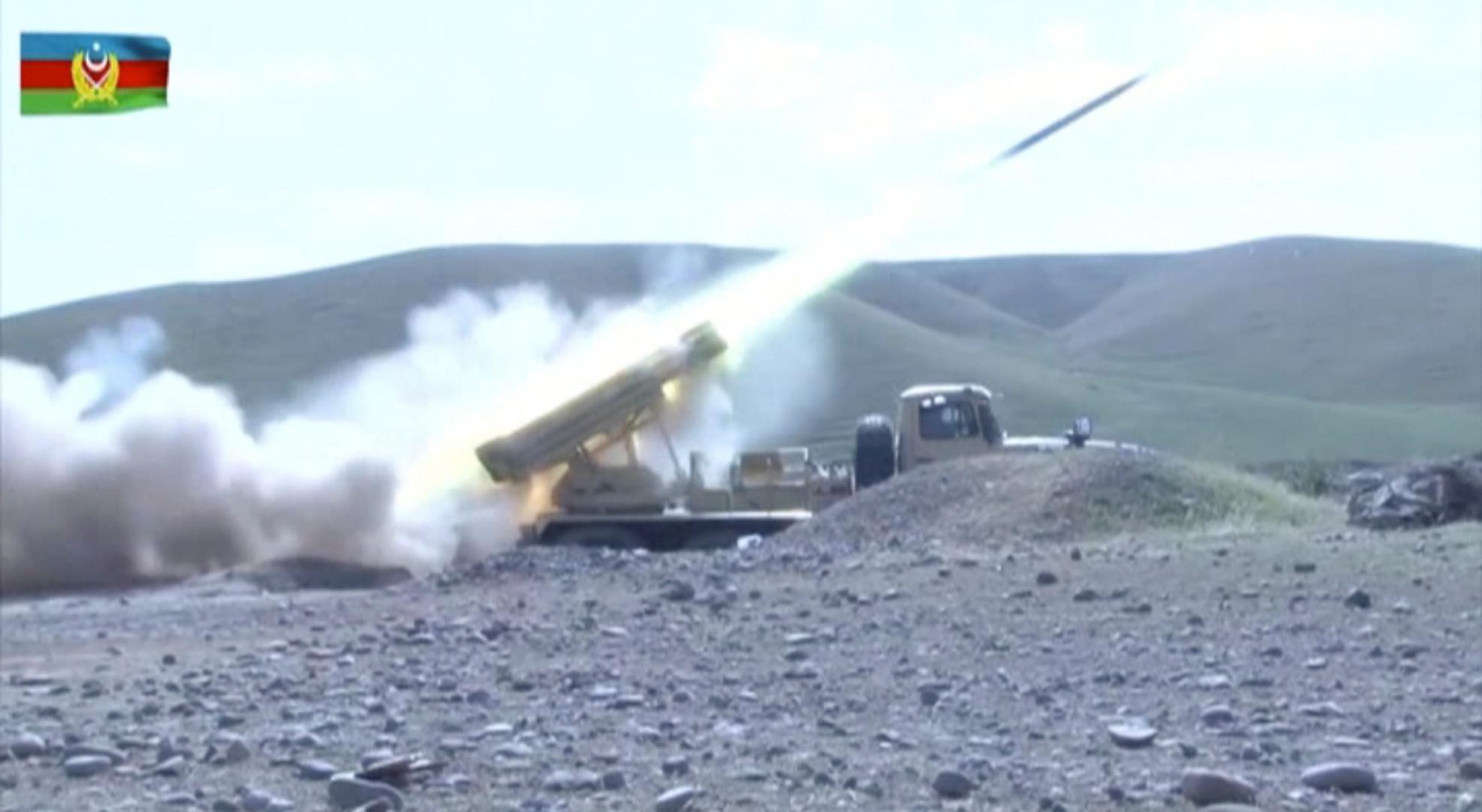 A still image shows an Azeri multiple rocket launcher performing strikes during clashes over the breakaway region of Nagorno-Karabakh A still image from a video released by Azerbaijan's Defence Ministry shows a multiple rocket launcher of the Azeri armed forces performing strikes during clashes over the breakaway region of Nagorno-Karabakh in an unknown location in Azerbaijan, in this still image from footage released September 30, 2020. Defence Ministry of Azerbaijan/Handout via REUTERS  ATTENTION EDITORS - THIS IMAGE HAS BEEN SUPPLIED BY A THIRD PARTY. NO RESALES. NO ARCHIVES. MANDATORY CREDIT. DEFENCE MINISTRY OF AZERBAIJAN