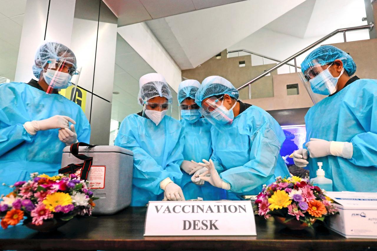 FILE PHOTO: Health officials prepare the AstraZeneca's COVID-19 vaccines manufactured by the Serum Institute of India, at army Hospital in Colombo