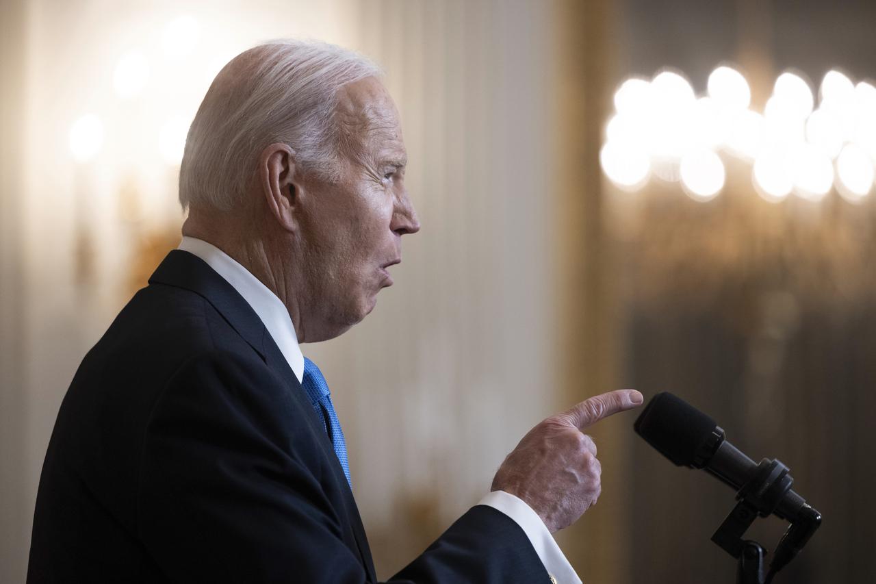 US President Joe Biden delivers remarks in the State Dining Room of the White House