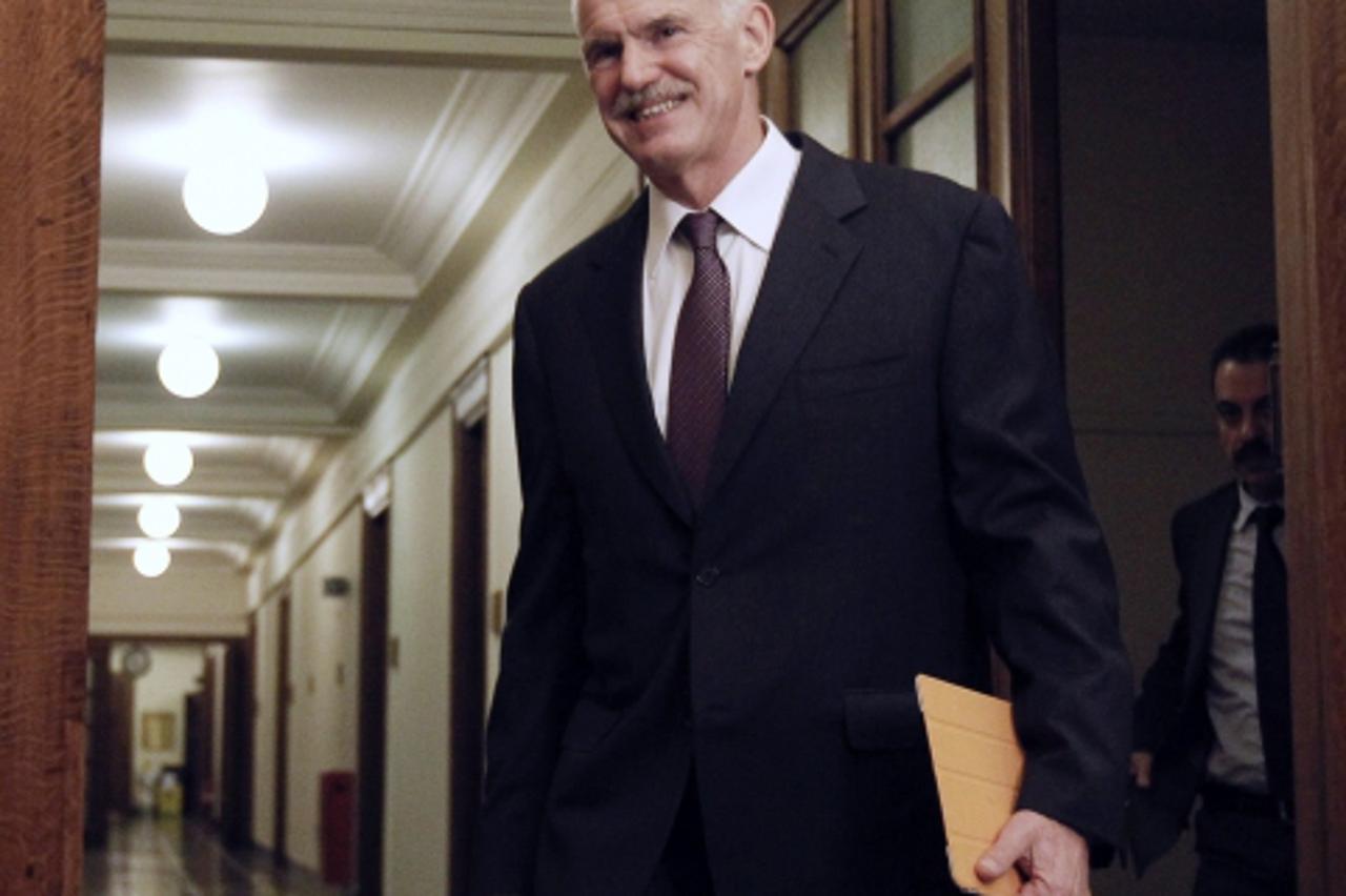 'Greece\'s Prime Minister George Papandreou arrives for a cabinet meeting inside the parliament in Athens November 1, 2011. The Greek government faced possible collapse on Tuesday as ruling party lawm