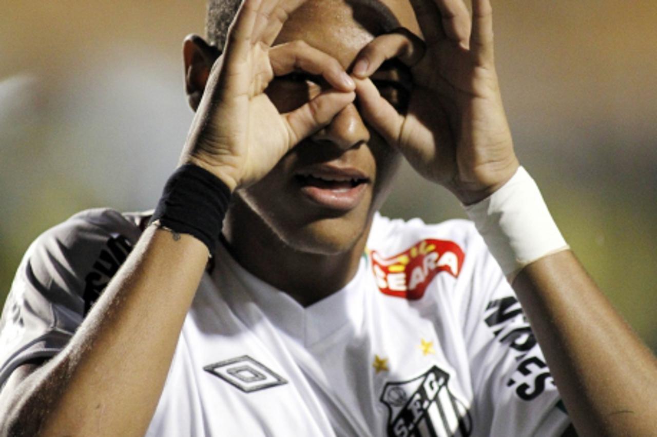 'Neymar, of Brazil\'s Santos FC, celebrates his goal scored against Venezuela\'s Deportivo Tachira, during their 2011 Copa Libertadores football match held at Pacaembu stadium, in Sao Paulo, Brazil, o