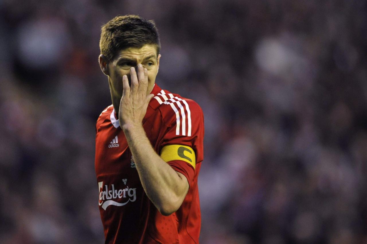 'Liverpool\'s Steven Gerrard reacts during their Europa League semi-final, second leg soccer match against Atletico Madrid in Liverpool, northern England April 29, 2010. REUTERS/Dylan Martinez (BRITAI