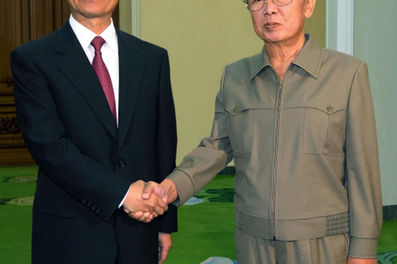 'This picture released from North Korea\'s official Korean Central News Agency on October 6, 2009 shows Chinese Prime Minister Wen Jiabao (L) shaking hands with North Korean leader Kim Jong-Il at the 
