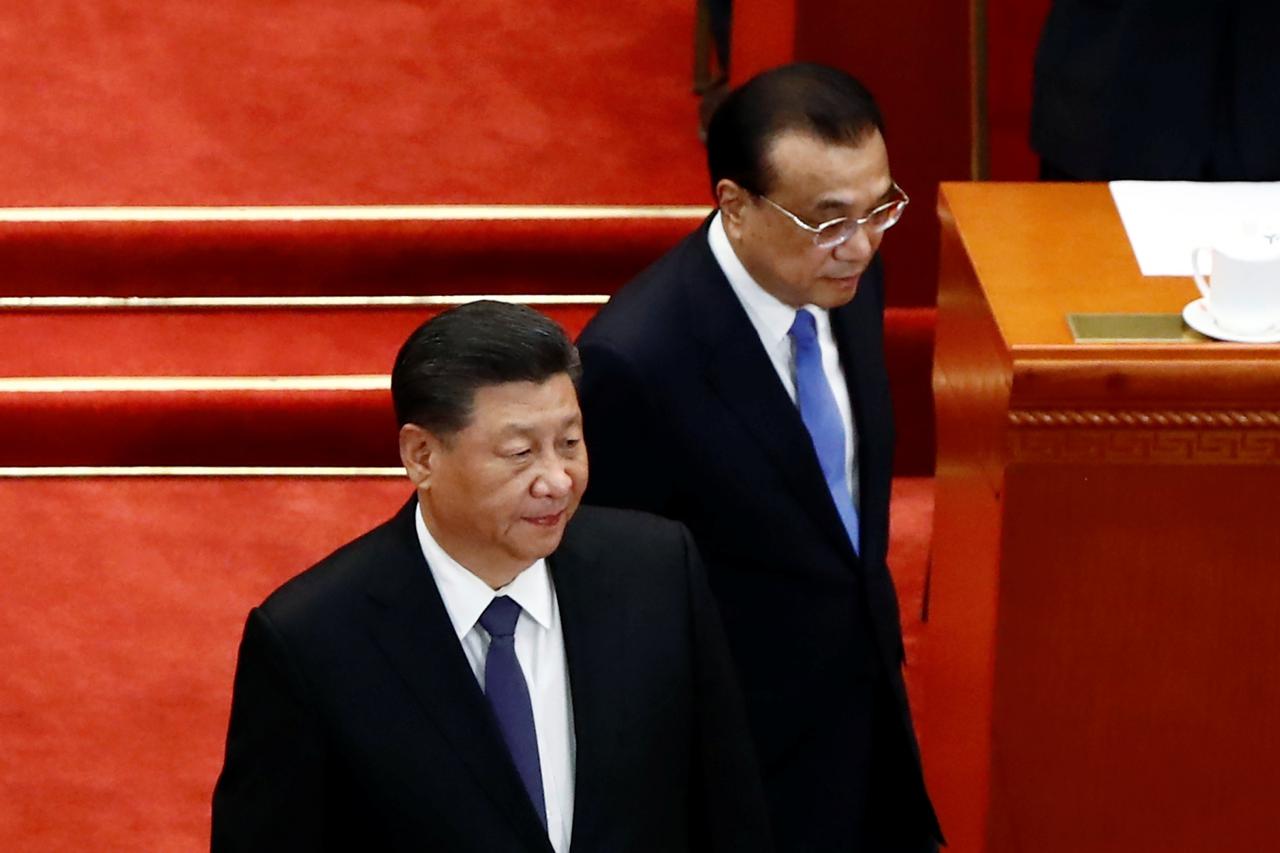 Chinese President Xi Jinping and Premier Li Keqiang arrive for the closing session of CPPCC in Beijing