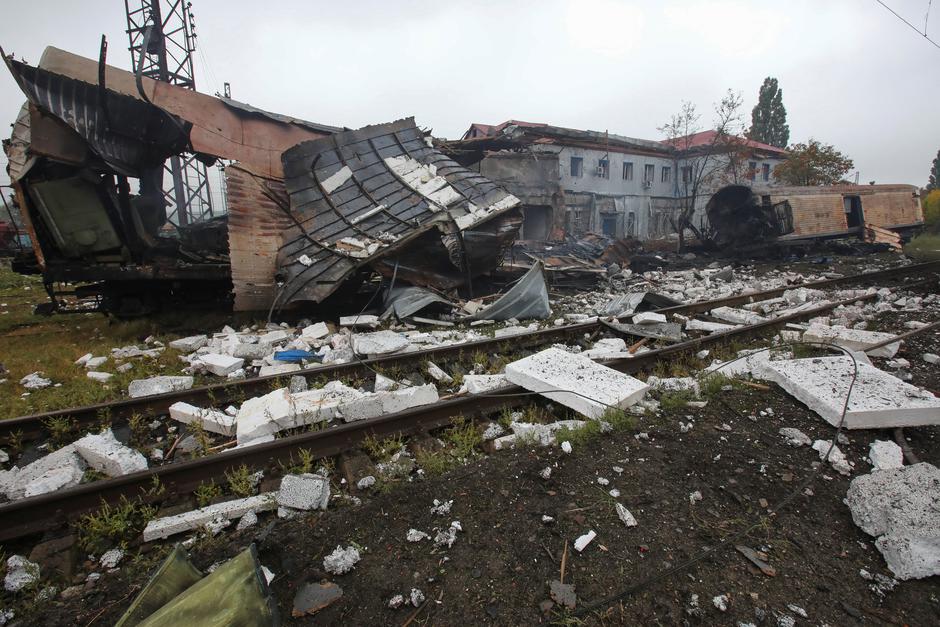 Railway cars destroyed by a Russian missile strike are seen at a cargo terminal in Kharkiv